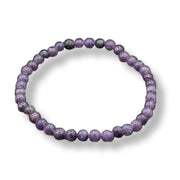 Purple beaded bracelet on a white background