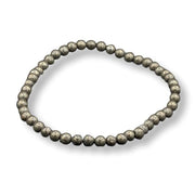 Pyrite beaded bracelet on a white background