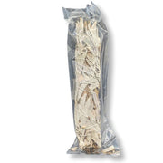 Clear plastic bag with sage and yerba santa inside on a white background