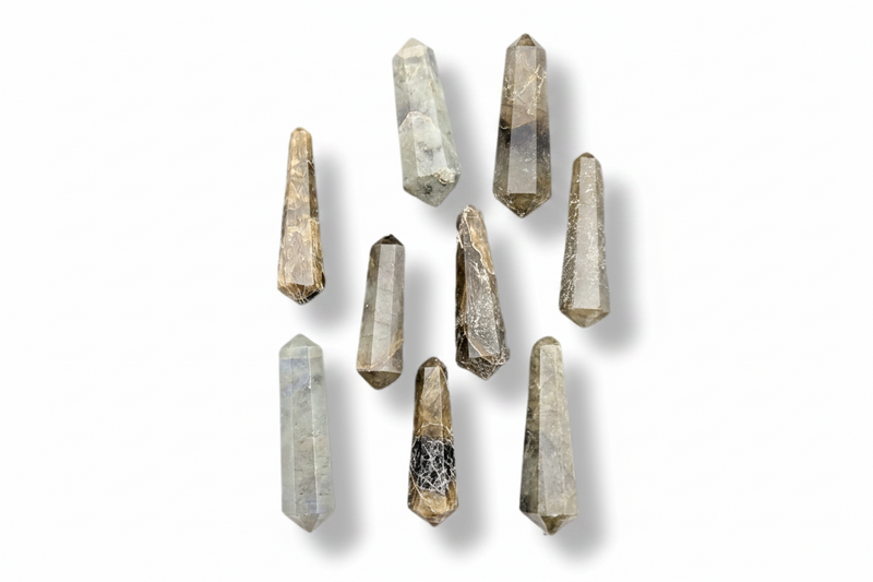 A set of nine natural labradorite  points of varying shapes and sizes, displayed against a clean white background with soft drop shadows.