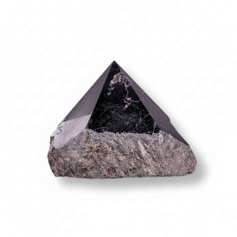 Pyramidal stone crystal on a white background