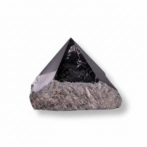 Pyramidal stone crystal on a white background