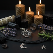 Wiccan or pagan altar setup with candles, crystals, lavender, and metallic charms on a dark surface.