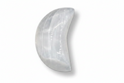 A selenite moon shown against a plain white background with a soft drop shadow.