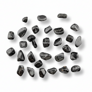 Collection of black stones on a white background