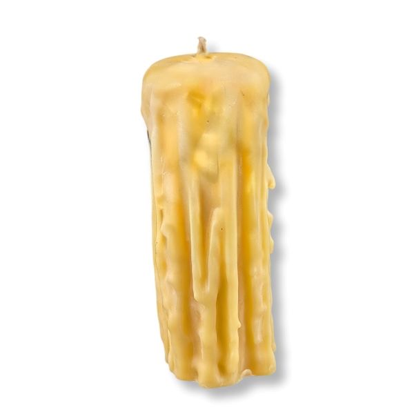 Textured yellow candle on a white background