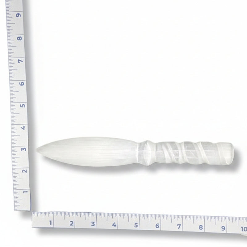 Two white selenite knives  with a ruler for scale on a white background