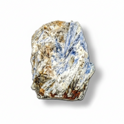 Raw sapphire crystal on a white background