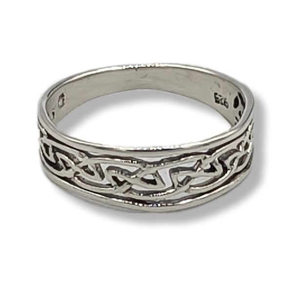 Silver ring with intricate Celtic knot design on a white background