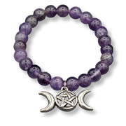 Purple beaded bracelet with silver triple moon charm on a white background