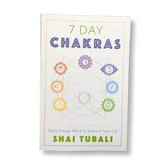 Book titled '7 Day Chakras' by Shai Tubali with colorful chakra symbols on a white background