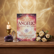 Book titled 'Angelic Lightwork' by Alana Fairchild on a wooden surface with decorative items.