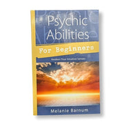 Book titled 'Psychic Abilities for Beginners' by Melanie Barnum with a sunset design on the cover.