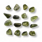 A set of polished green tumbled stones arranged in a loose grid on a white background with soft drop shadows.
