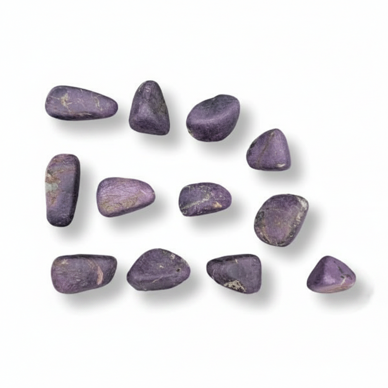 Purple stones arranged in a scattered pattern on a white background