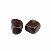 Two brown stones on a white background