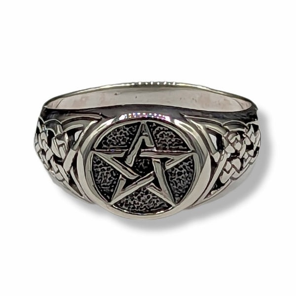 Silver ring with pentagram design on a white background