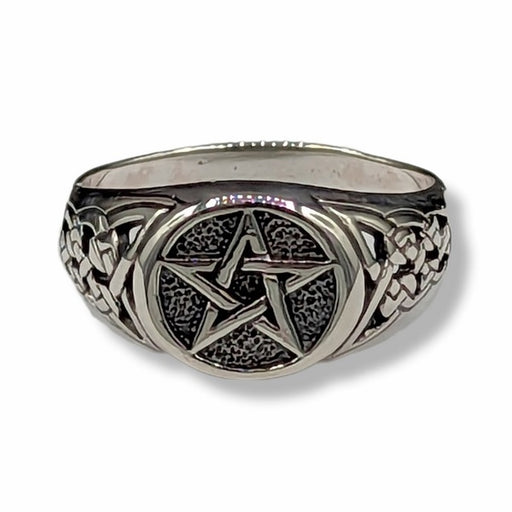 Silver ring with pentagram design on a white background