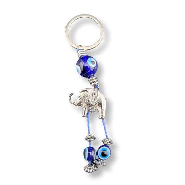 Keychain with elephant and eye-shaped beads on a white background
