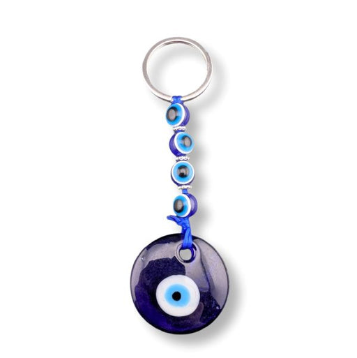 Keychain with blue evil eye design on a white background