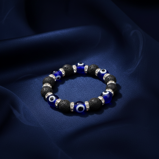 Bracelet with blue and black beads on a dark fabric background