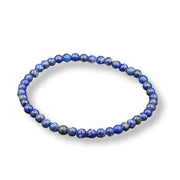 Blue beaded bracelet on a white background