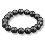 Black beaded bracelet on a white background