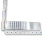 Selenite strip with ruler for scale on a white background
