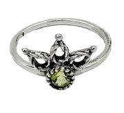 Silver ring with a green gemstone on a white  background