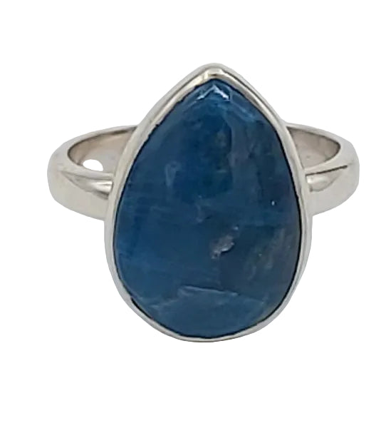 Silver ring with a blue stone on a white background