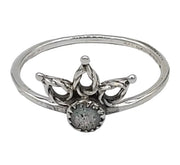 Silver ring with a decorative design on a white background