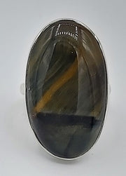 Ring with an oval stone on a white background