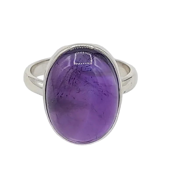 Silver ring with a purple gemstone on a white background