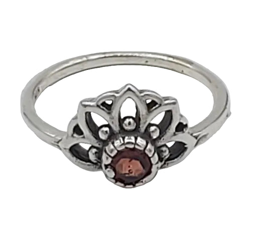 Silver ring with a central brown gemstone on a white background