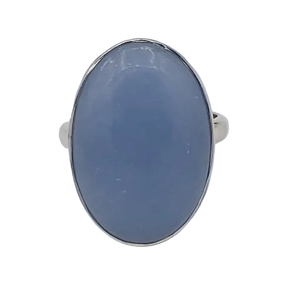Silver ring with a blue stone on a white  background
