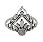 Silver ring with intricate design on a white  background