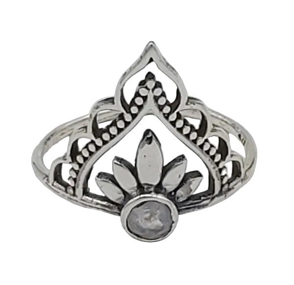 Silver ring with intricate design on a white  background