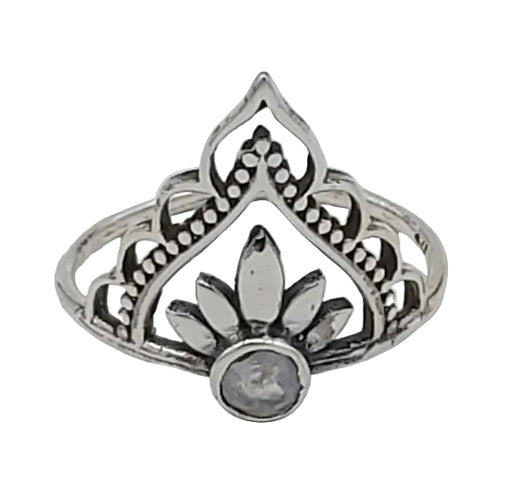 Silver ring with intricate design on a white  background