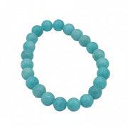 A beaded stretch bracelet made of round turquoise-blue beads with a small white geometric symbol carved or printed on each bead, displayed on a light gray background.