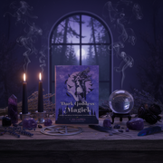 Magical setup with 'Dark Goddess Magick' book, candles, crystals, and a pentacle on a wooden surface.