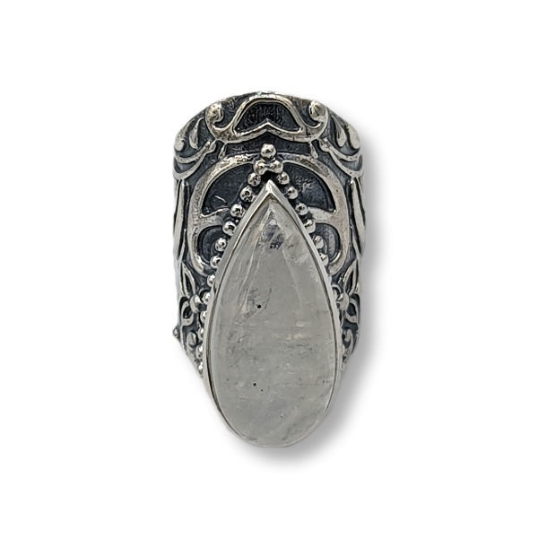Silver ring with teardrop-shaped stone on a white background