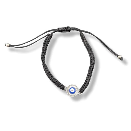 Black braided bracelet with a blue evil eye charm on a white background