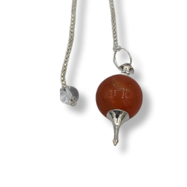 Pendulum with a brown stone and silver chain on a white background