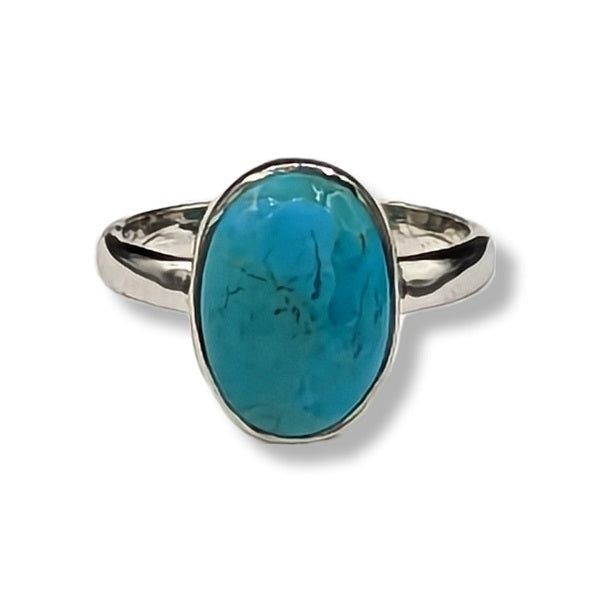 Silver ring with a turquoise stone on a white background