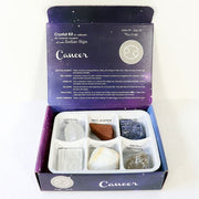 Crystal kit for Cancer zodiac sign with stones and packaging on a white background