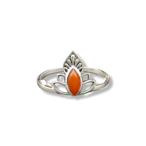 Silver ring with an orange stone on a white background