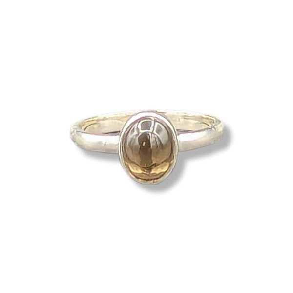 A sterling silver ring with a grey stone on a white background