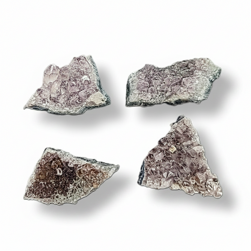 Four crystal rock specimens on a white background
