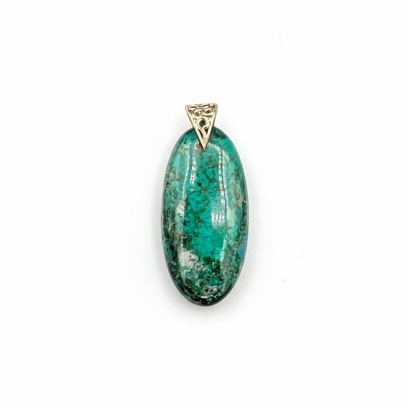 Green stone pendant next to a ruler on a white background
