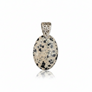 Pendant with dalmatian jasper stone and silver bail on a white background